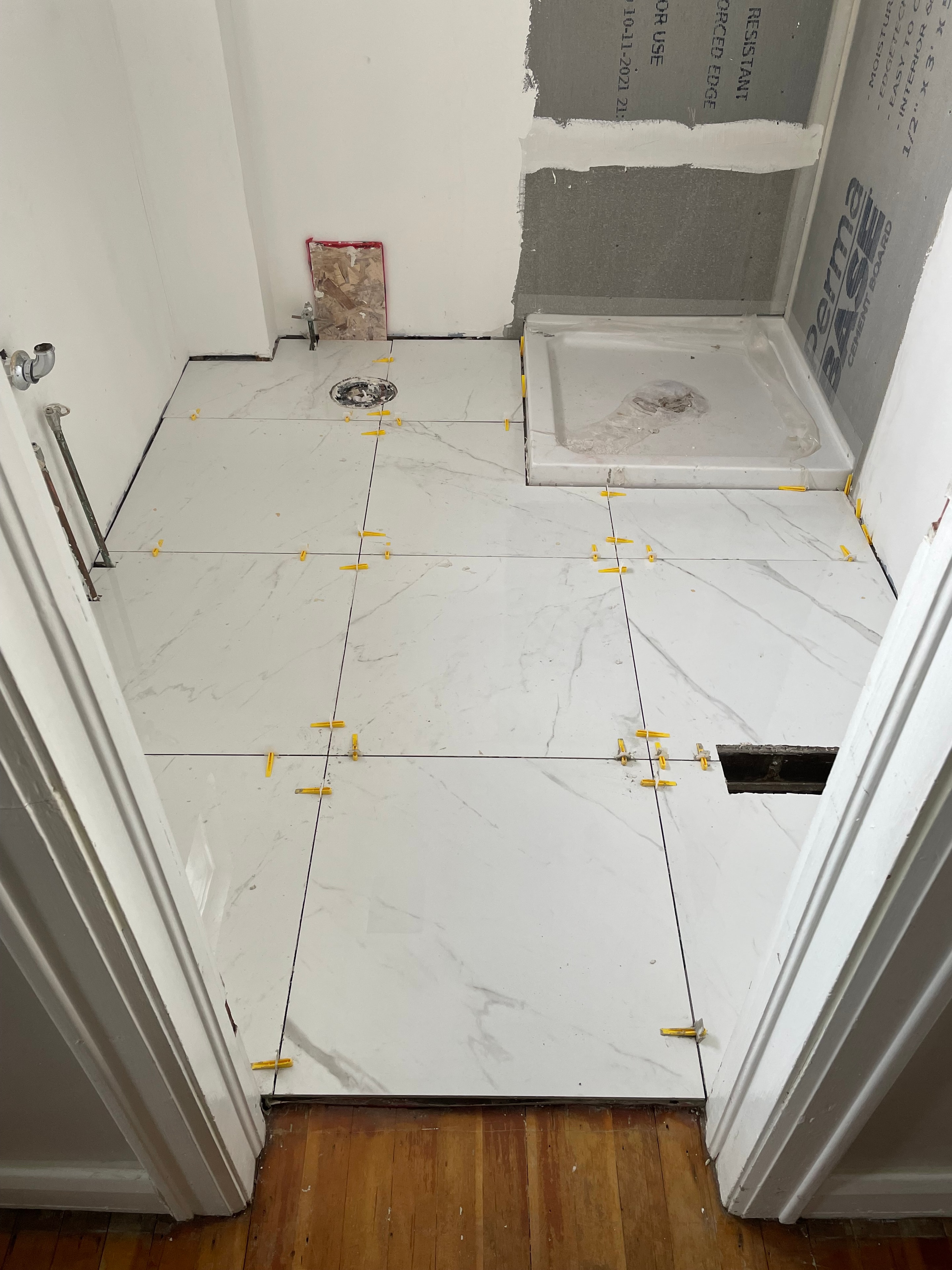 Paris ensuite during construction — marble tile being set with spacers